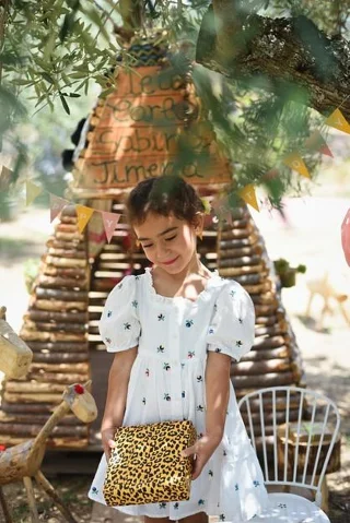 Happy girl with a birthday present in her hands Premium Photo