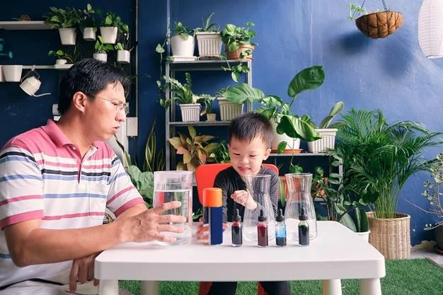 Father and son having fun preparing easy science experiment Premium Photo