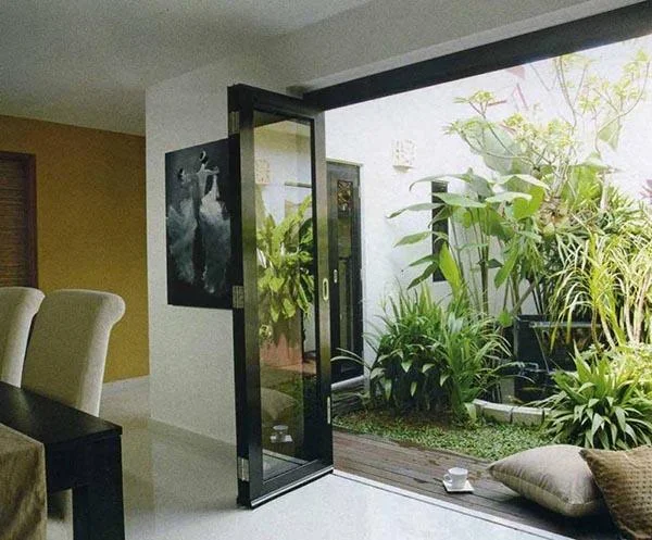 Consultoria de projeto Casa de 56m² com pequena paisagem para espaços verdes