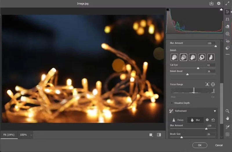 Why is Lens Blur a Photoshop tool used for artistic photo editing?