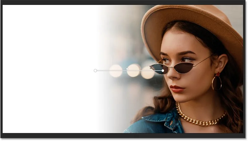 Hoe je snel een afbeelding in Photoshop kunt vervagen naar een achtergrondkleur met Live Gradients
