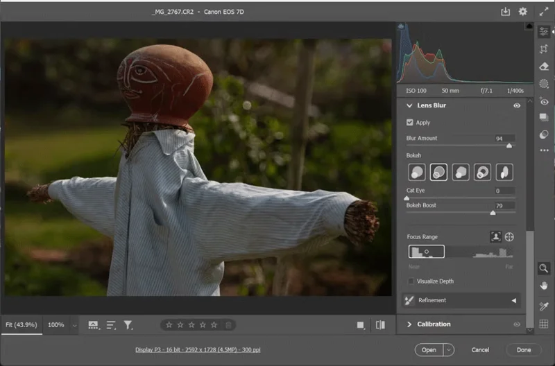Why is Lens Blur a Photoshop tool used for artistic photo editing?